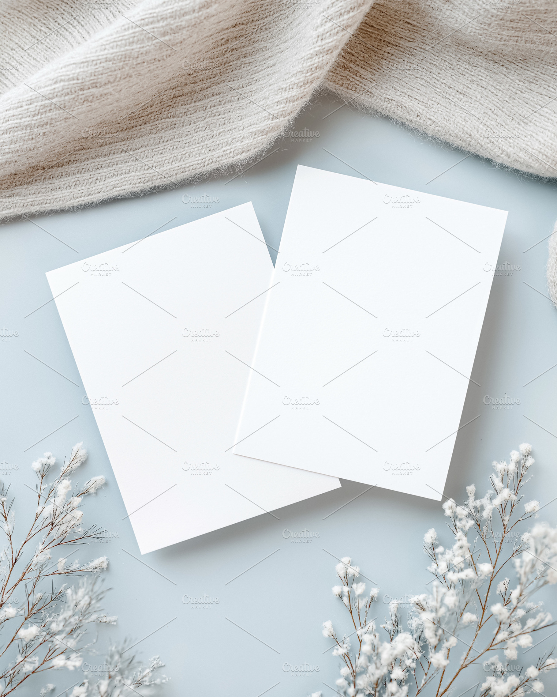 White blank cards template with cozy sweater and delicate winter flowers on a l, a Holiday Photo by Studio ANNA