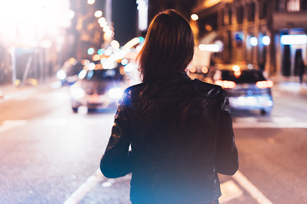 Girl in the city on a night street featuring concept, back, and black