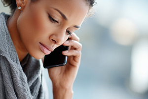 Focused young woman talking on phone, a Business Photo by MistyDay