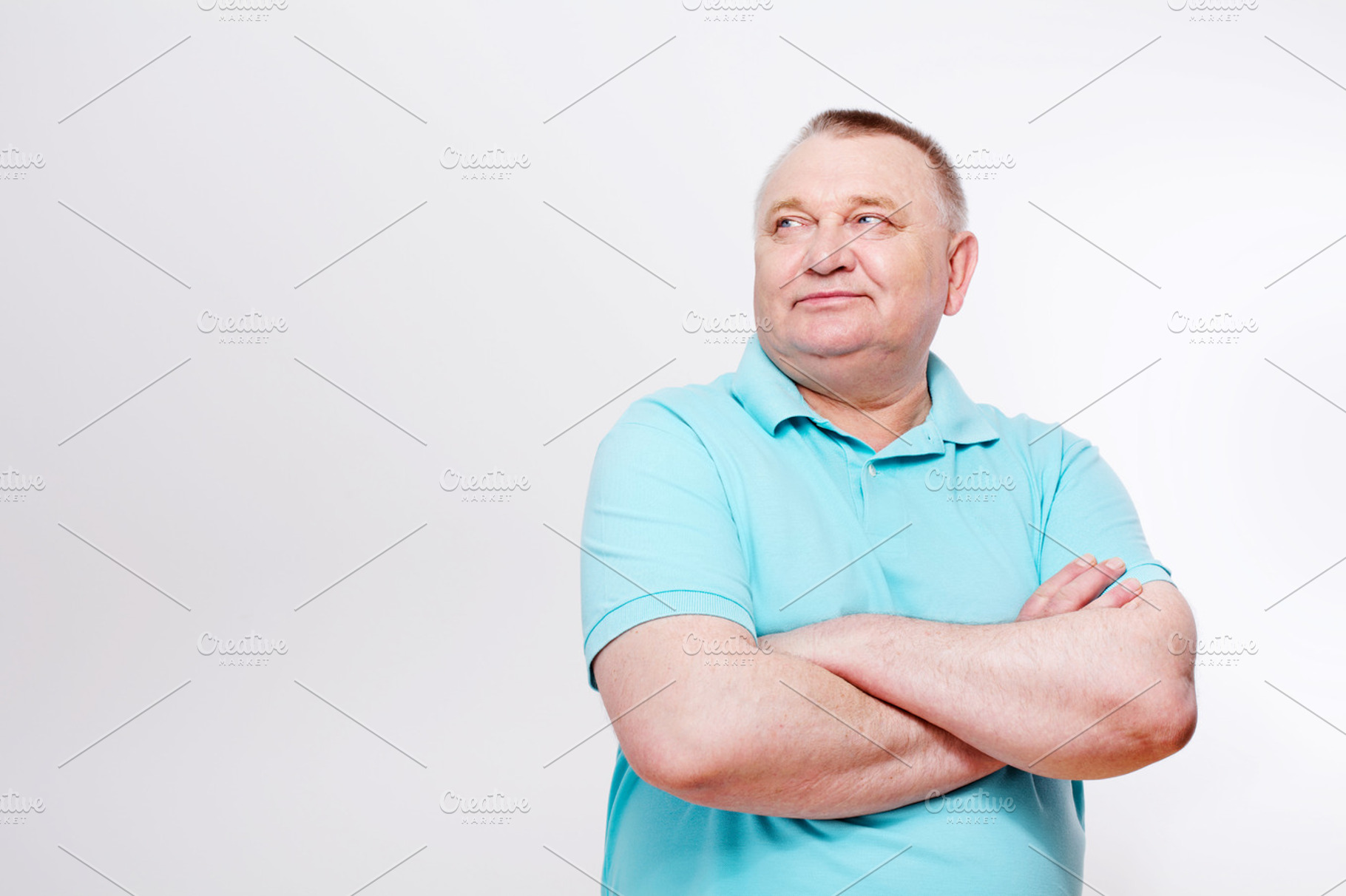Mature man with crossed hands