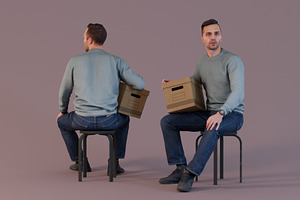 Man Sitting With Bankers Box