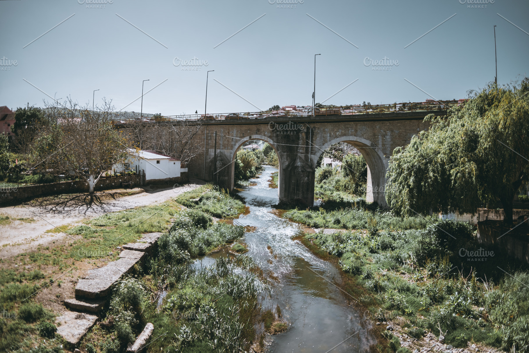 Stone bridge over countryside river, an Architecture Photo by SkyNext