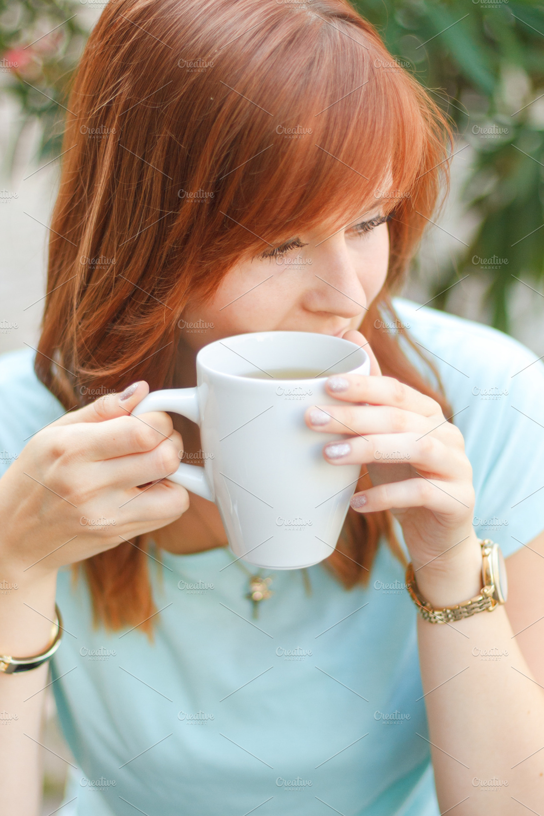 Woman with a cup of tea stock photo