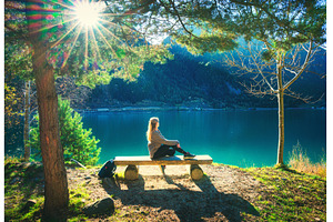 Young woman sitting on the bench, a Person Photo by den-belitsky