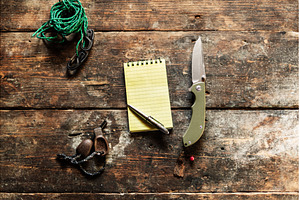 Yellow notebook and pen on the table, a Wallpaper Photo by Stockphoto by vzwer