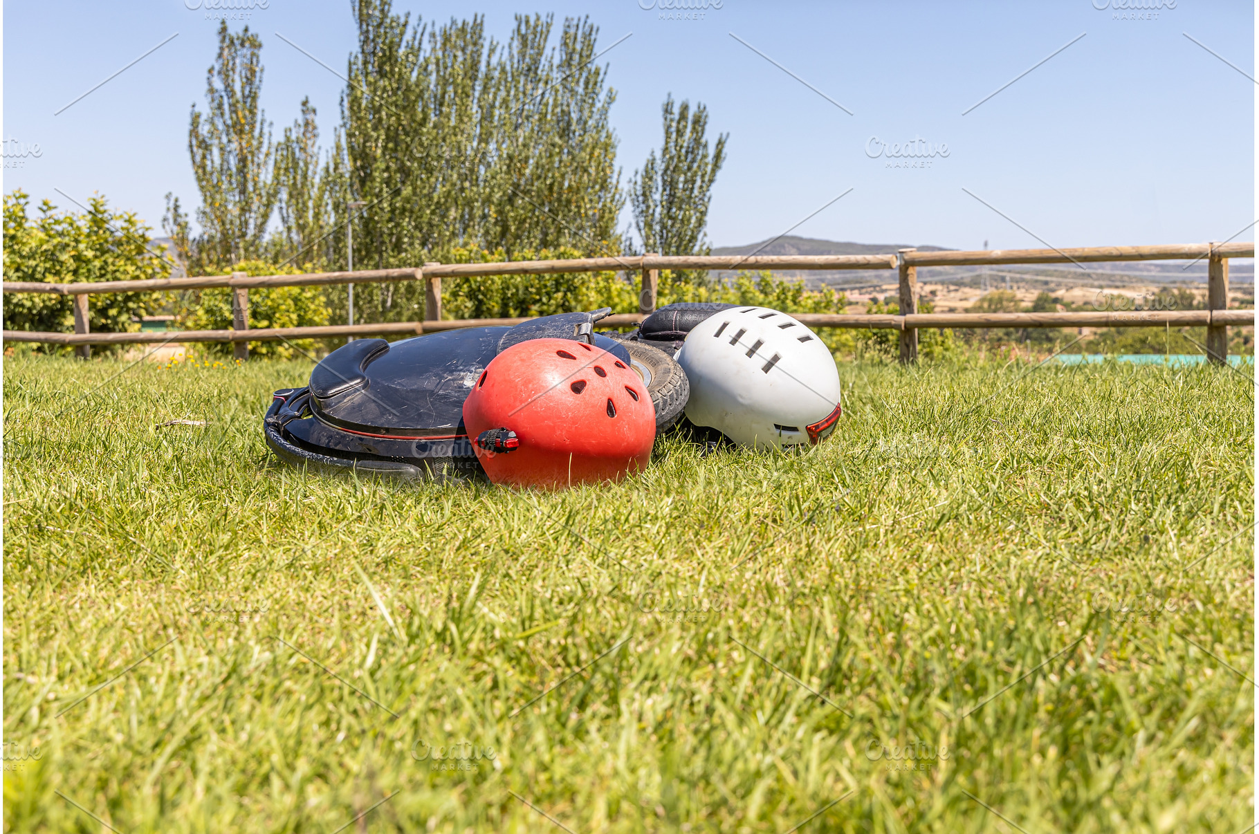 Electric unicycle with helmets lie, a Sports & Recreation Photo by Illustrations&photos