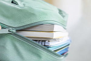 Closeup of books and notebooks insid, a Photo by Dvoevnore photos