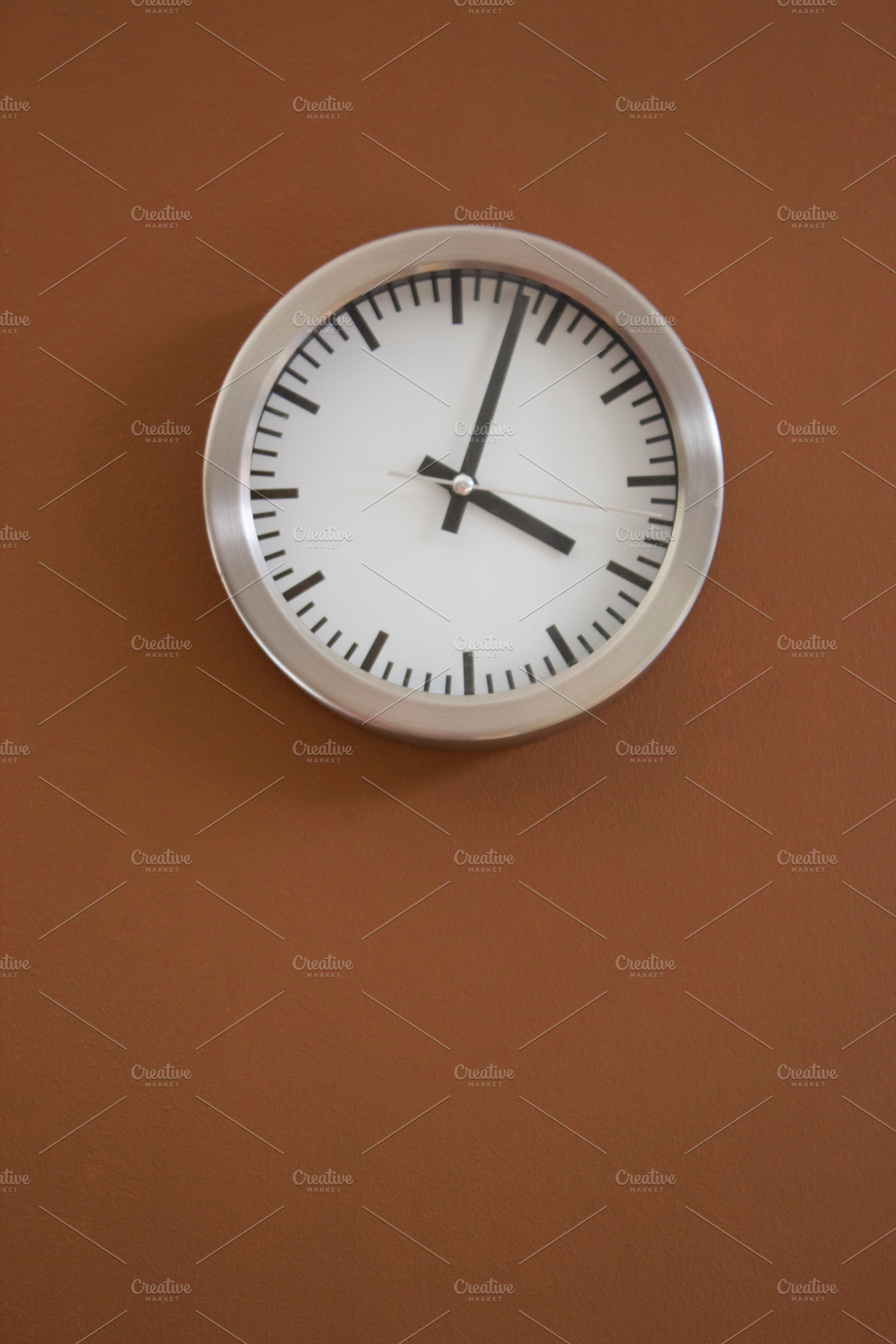 Aluminum clock on the wall