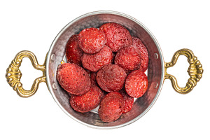 Fried Turkish sucuk (sujuk) slices in a traditional copper pan (, a Photo by composter-box@mail.ru