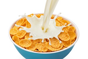 Corn flakes with pouring milk