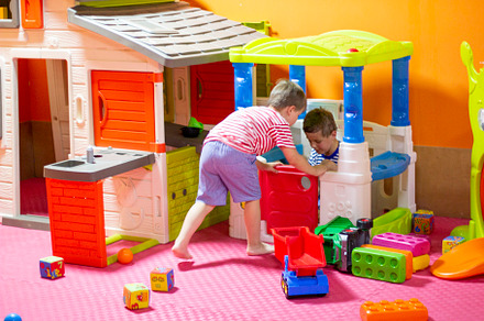 Children play in indoor playground.