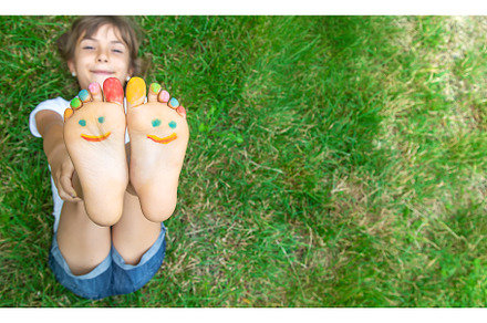 Children's feet with a pattern of, a Nature Photo by yanadjana
