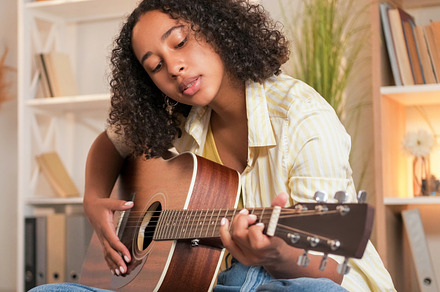 Guitar playing music lesson creative woman home, a Person Photo by Photo Drive Studio