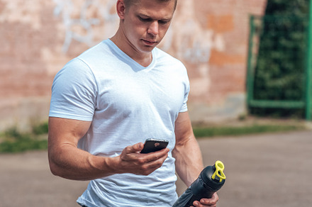A male athlete goes in for sports in the open air muscular arms blonde in a