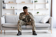 Pensive african american soldier in military uniform sitting on couch, a Photo by Prostock-Studio (Thumbnail 1 of 5)