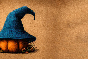 Pumpkin with large blue witch hat surrounded by autumn foliage o, a Food & Drink Photo by José Manuel Gelpi