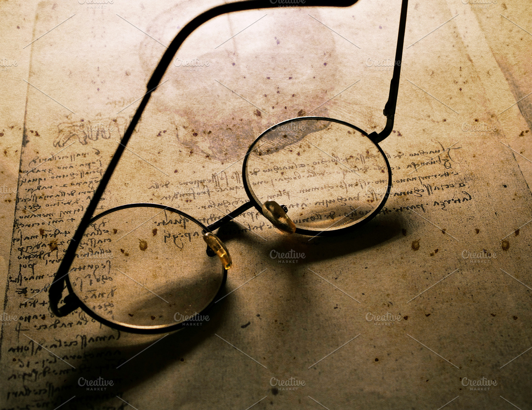 Classic spectacles on old paper featuring ancient, antique, and antiques, a School & Education Photo by graphic 9