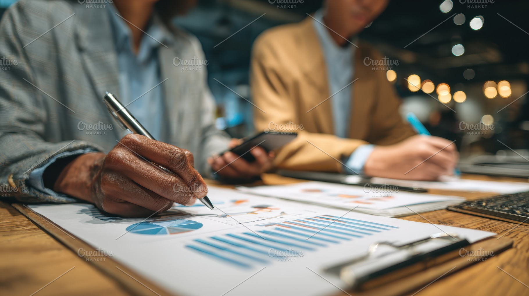 Businesspeople reviewing financial c, a Photo by Pixeness Studio