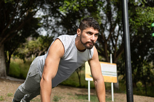 Young man doing push-ups workout in park outdoors, a Sports & Recreation Photo by etorres69