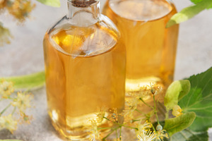 Linden flower essential oil in glass bottles, a Health & Medical Photo by Olena Rudo