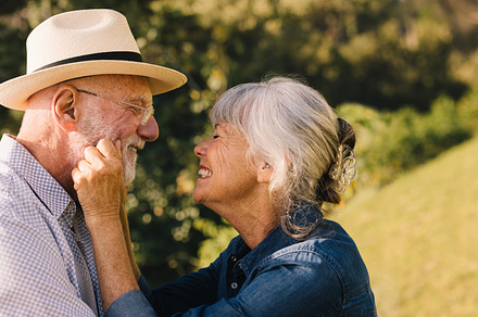 Elderly couple smiling at each other and expressing their love, a Person Photo by Jacob Lund