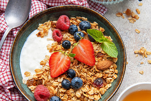 Granola yogurt parfait with fresh berries and honey, a Food & Drink Photo by Olena Rudo