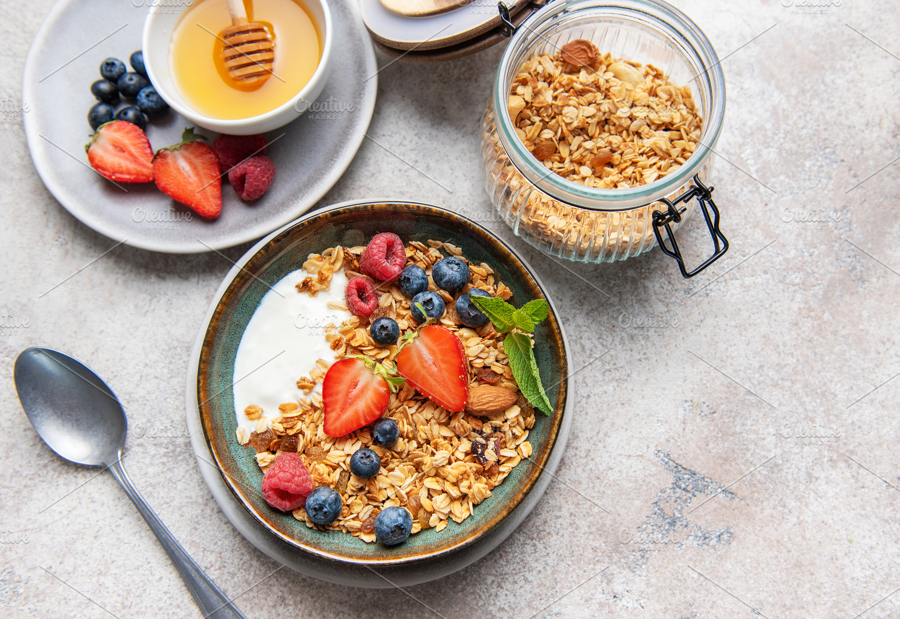 Granola bowl with yogurt berries and honey, a Food & Drink Photo by Olena Rudo