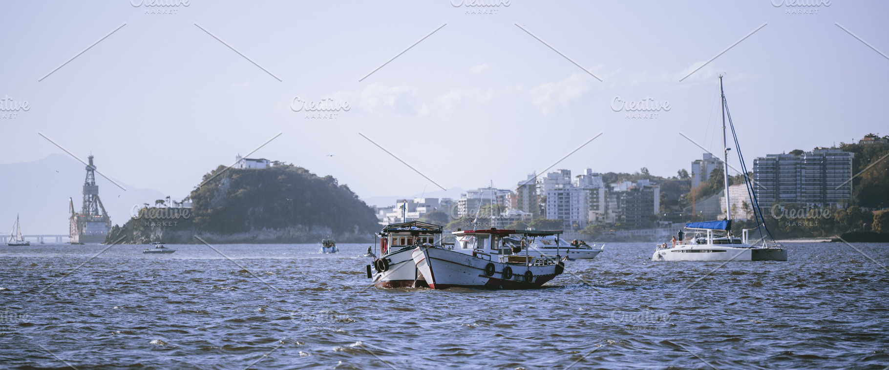 Boats in bay with skyline, a Transportation Photo by SkyNext