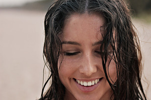 Smiling girl at the beach in Summer