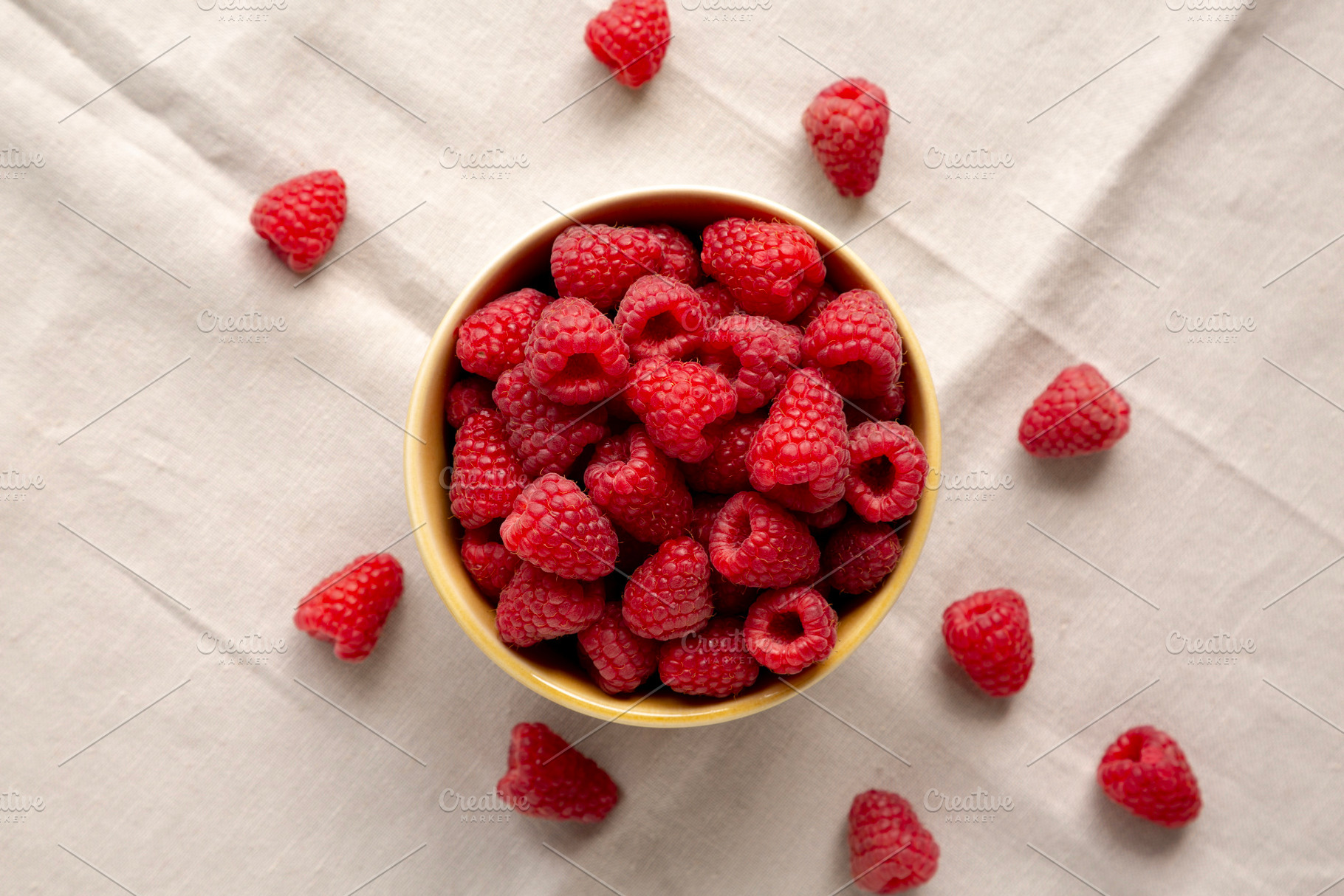 Organic Raw Red Raspberries in a Bowl, top view., a Food & Drink Photo by LiudmylaChuhunova