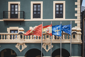 Flags in front of European building, an Architecture Photo by SkyNext