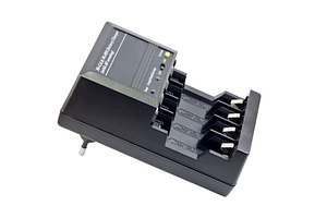 Battery charger featuring charger, battery, and charge, a Technology Photo by Leonid Andronov