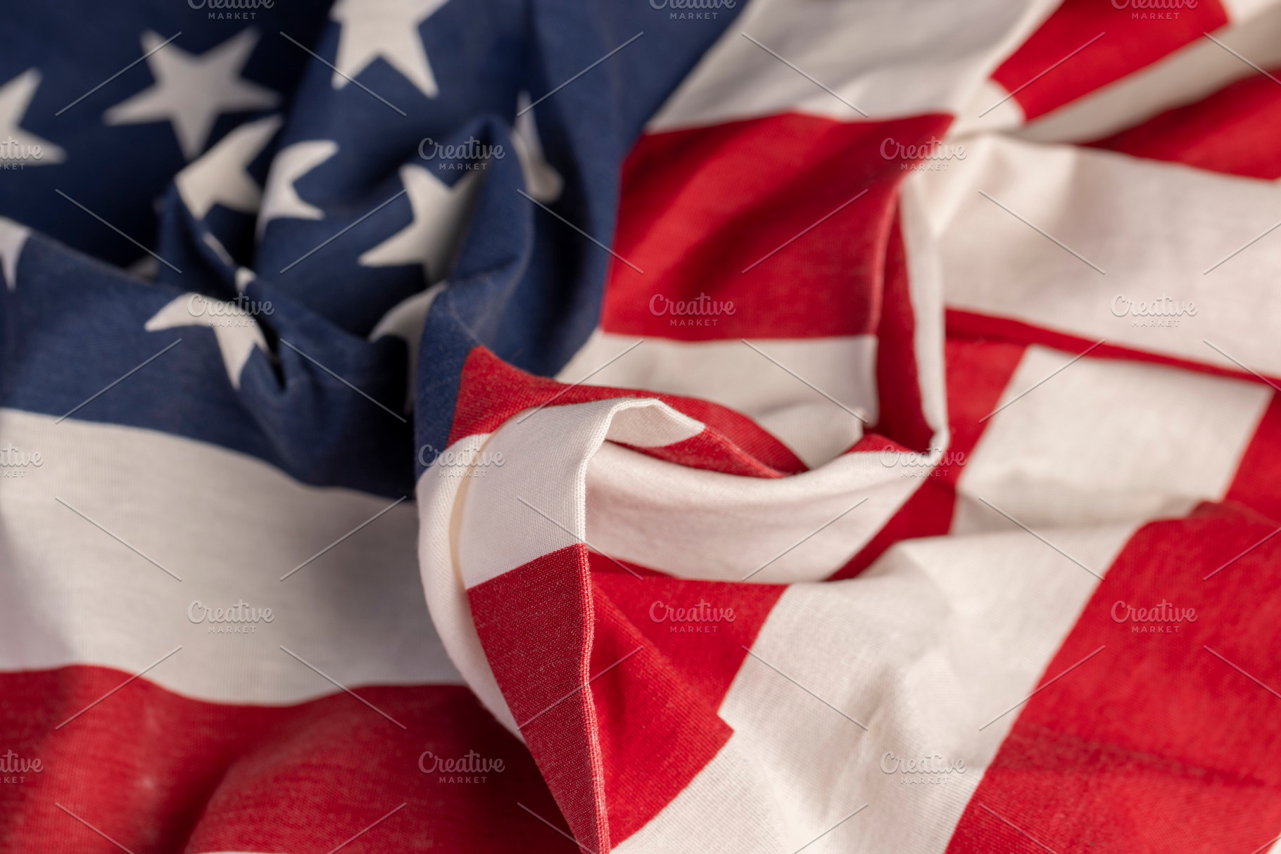 part of the American flag with stars and red and white stripes, a Photo by MyPhotos