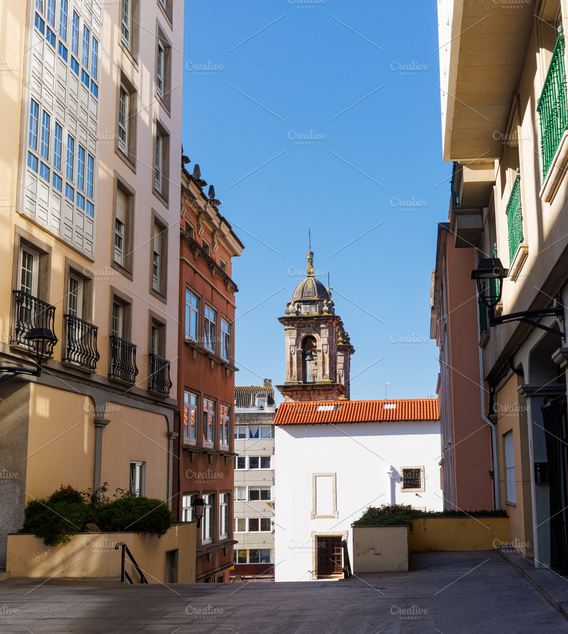 Historic rooftops and dome of the Church of St. George in La Cor, an Architecture Photo by Bepslabor