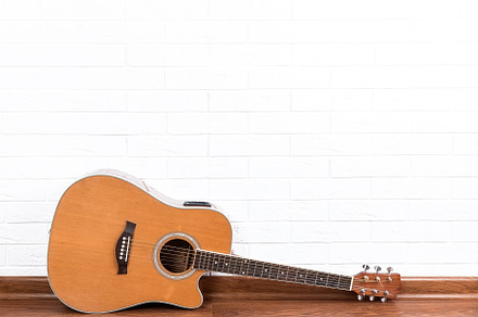 Guitar on a brick wall background., an Arts & Entertainment Photo by AlexBush