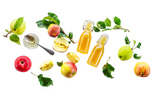 Apple cider vinegar against a, a Food & Drink Photo by yanadjana
