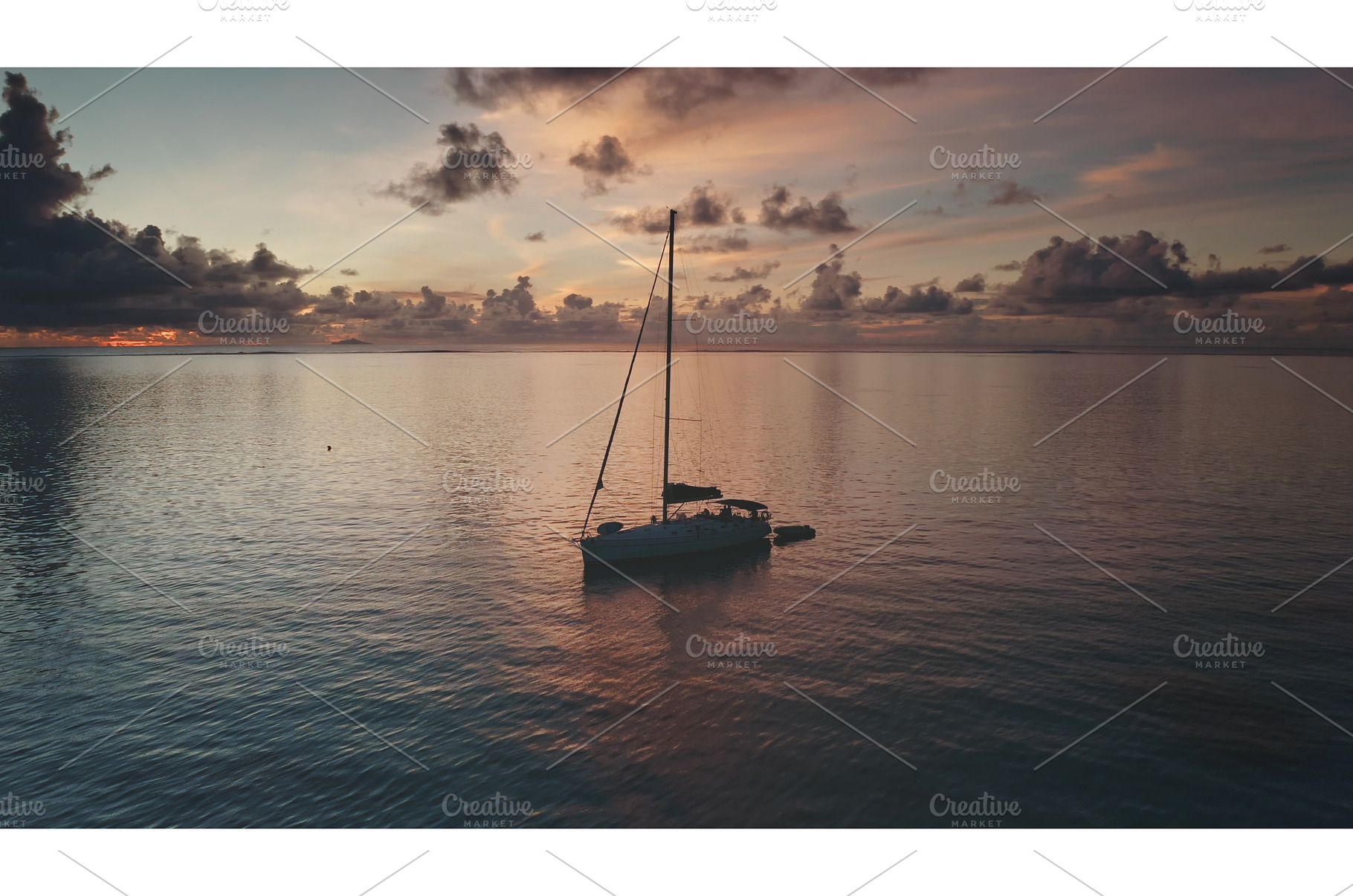 Sailboat floating on calm ocean at, a Nature Photo by Goinyk