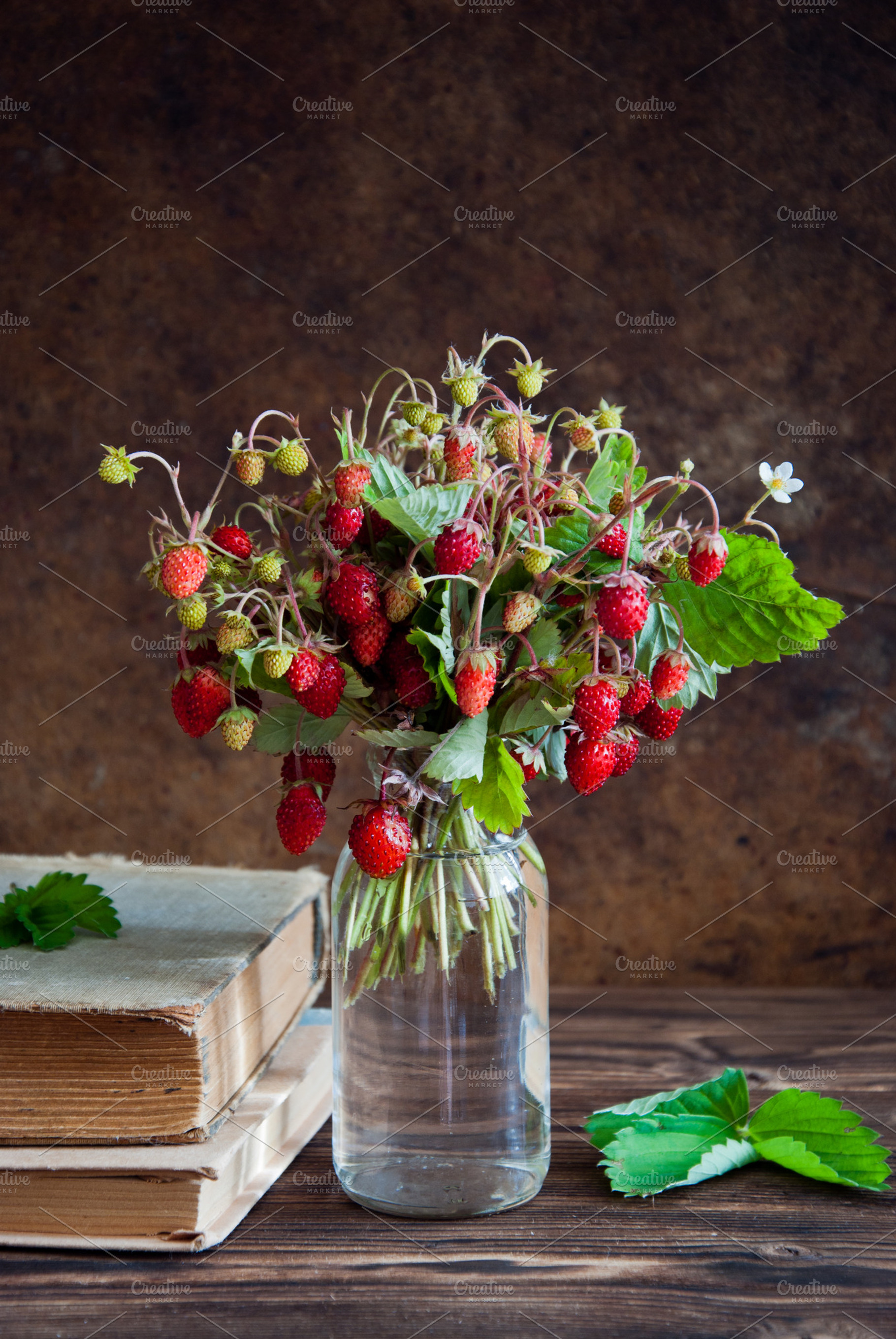 Strawberries and old books stock photo containing antique and berry, a Food & Drink Photo by letterberry