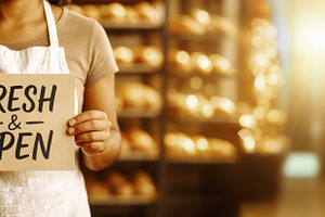 Small business owner holding fresh a, a Photo by Dvoevnore photos