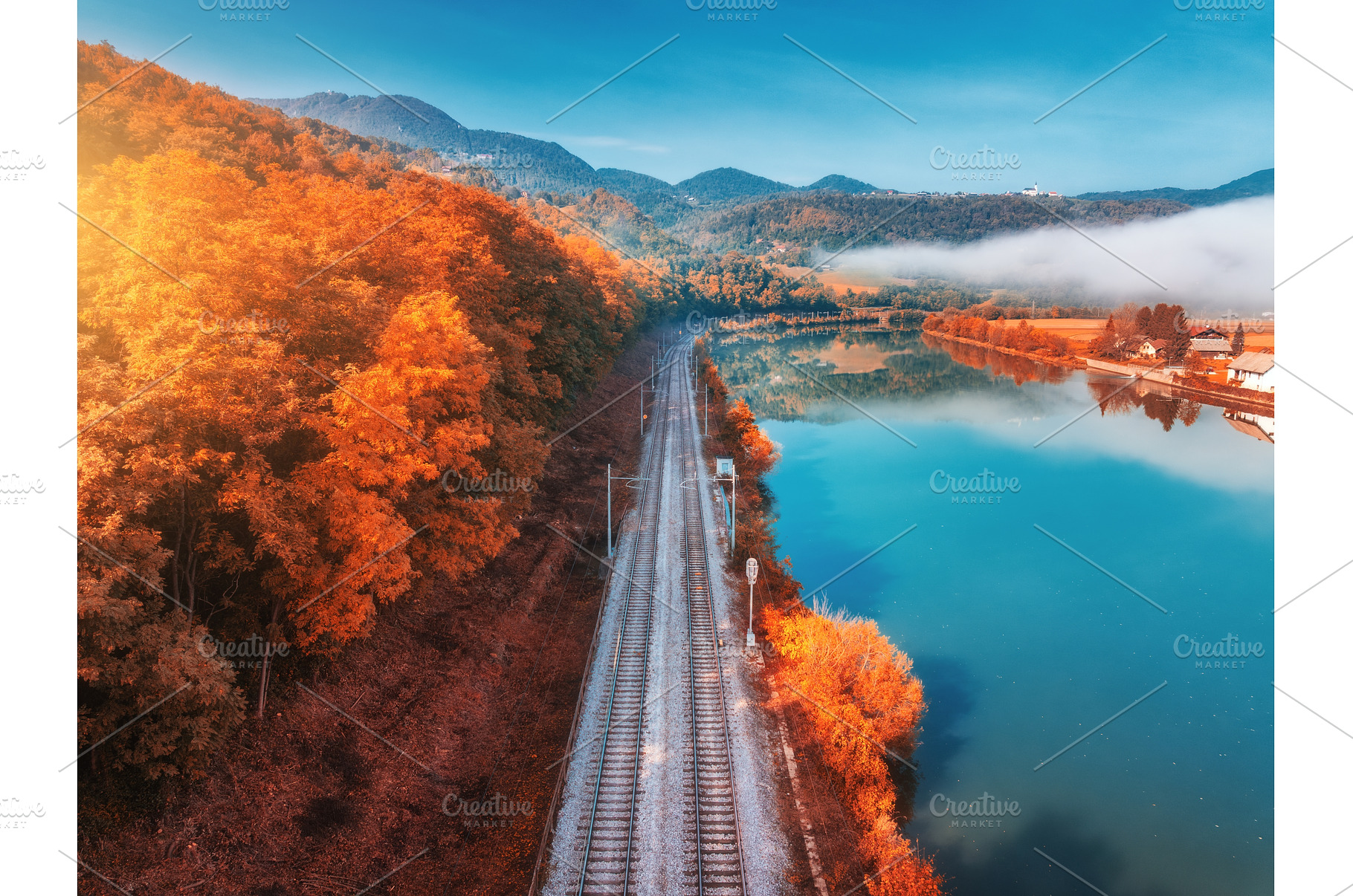 Aerial view of railroad, alpine lake, a Transportation Photo by den-belitsky