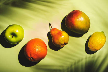 Summer fruits top view. Contemporary still life, lime green back, a Food & Drink Photo by 5PH