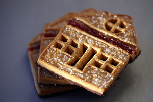 Sweet house-shaped cookies decorated with sugar and red fruit jam., a Food & Drink Photo by Rohan Photography