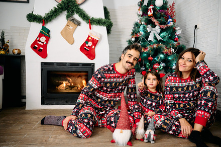 Family wearing matching Christmas pajamas, a Holiday Photo by YossSabalet