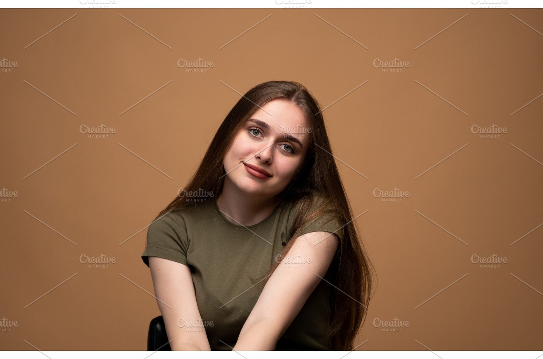 Young woman smiling gently, head, a Person Photo by volodymyrshtun13795