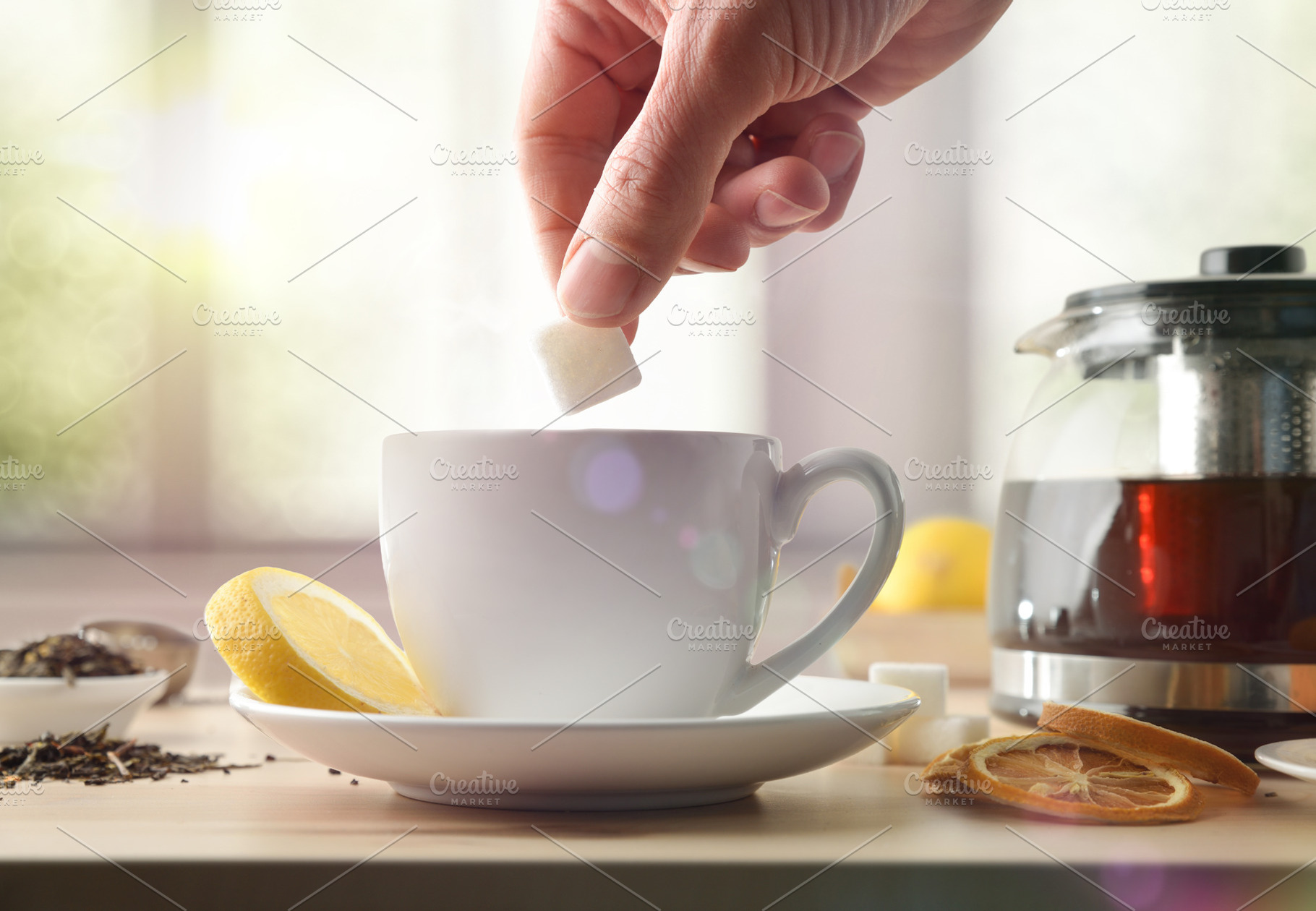 Putting a sugar cube in tea in the morning, a Food & Drink Photo by Davizro's Market
