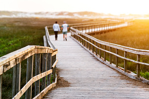 elderly senior couple in footbridge