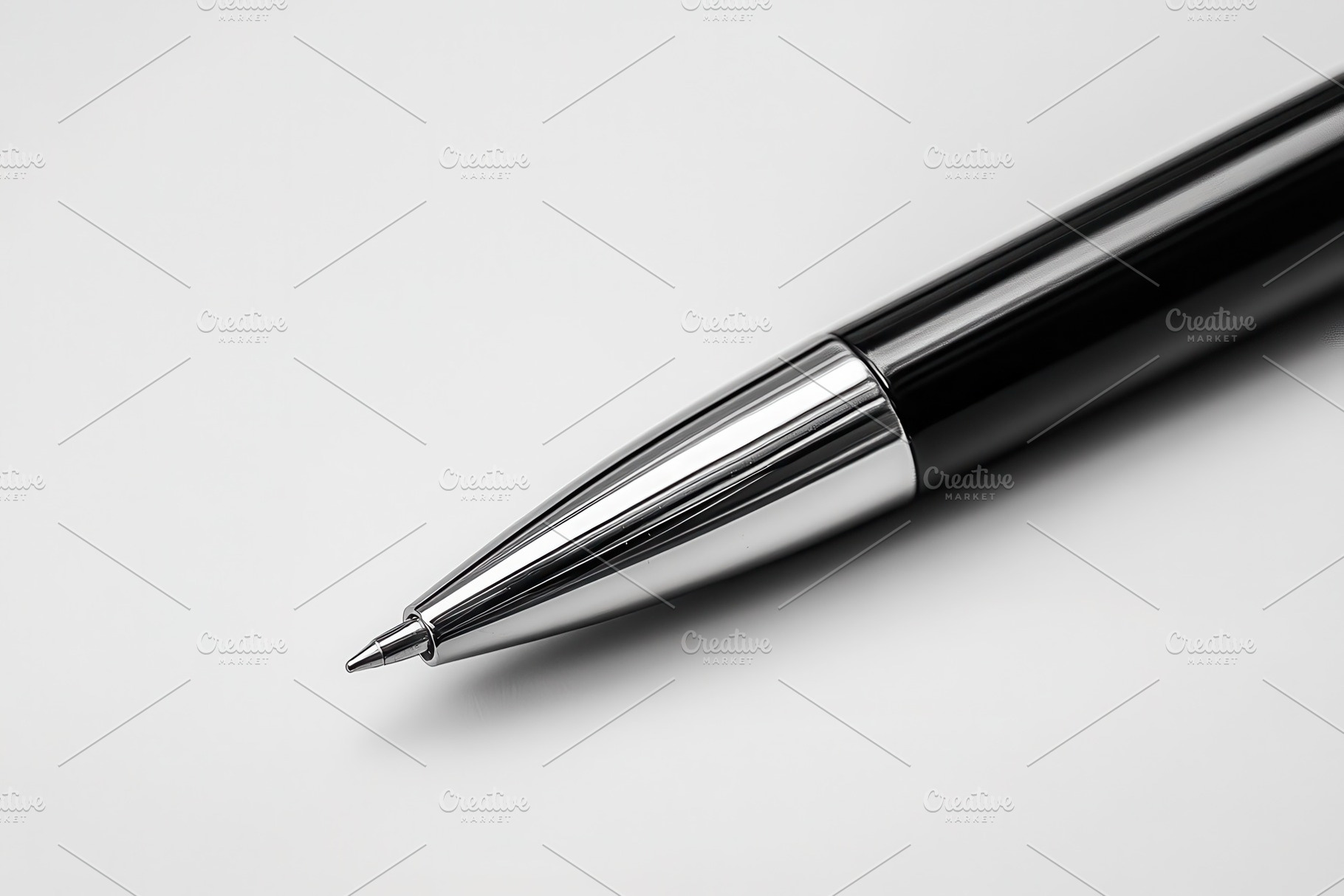 Sleek black ballpoint pen resting, a Photo by Pavel_design