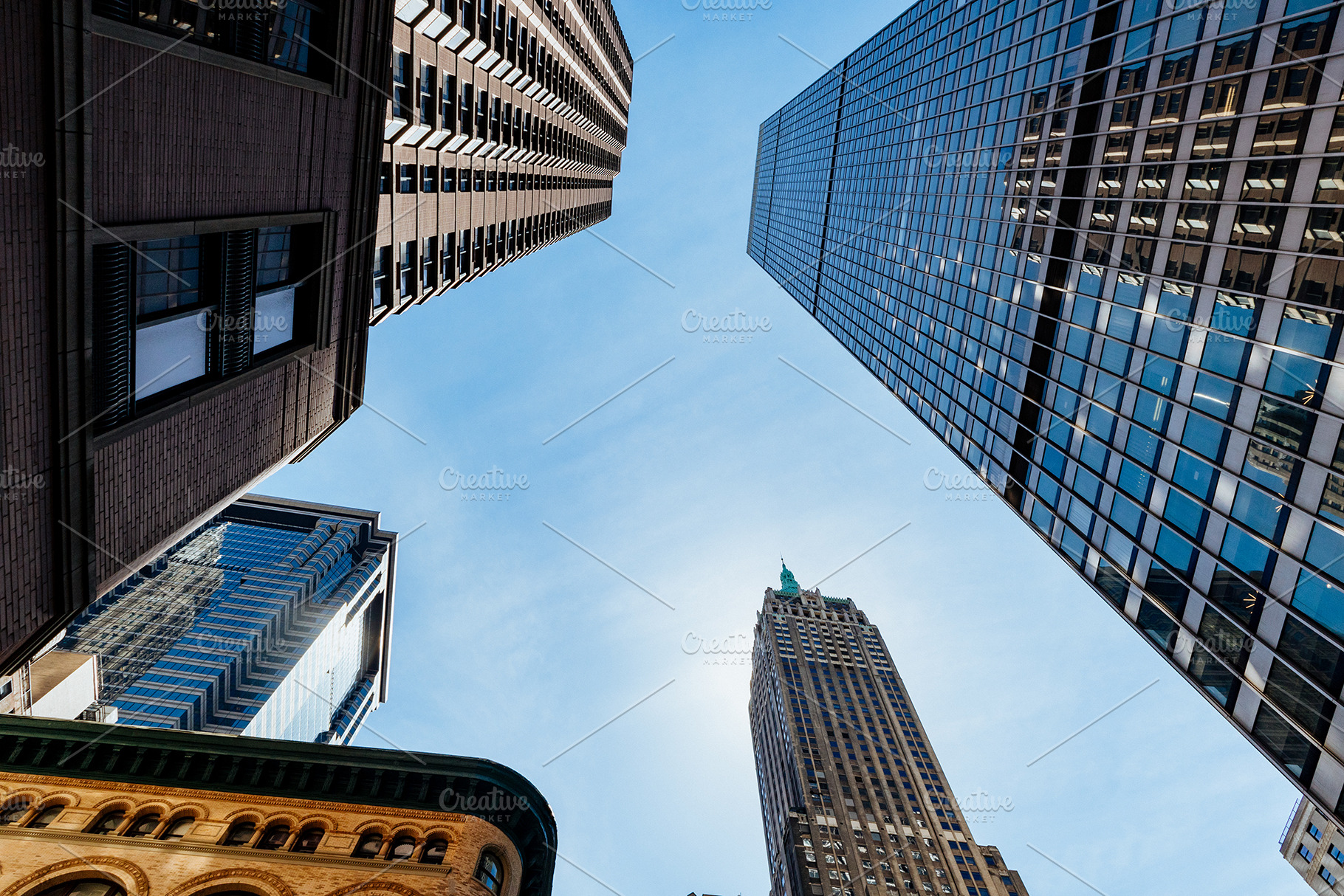 Looking up at tall buildings featuring architecture, building, and business, a Business Photo by Dan Gold