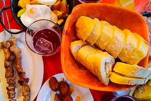 Assorted tapas and bread on colorful table, a Food & Drink Photo by DanFLCreativo