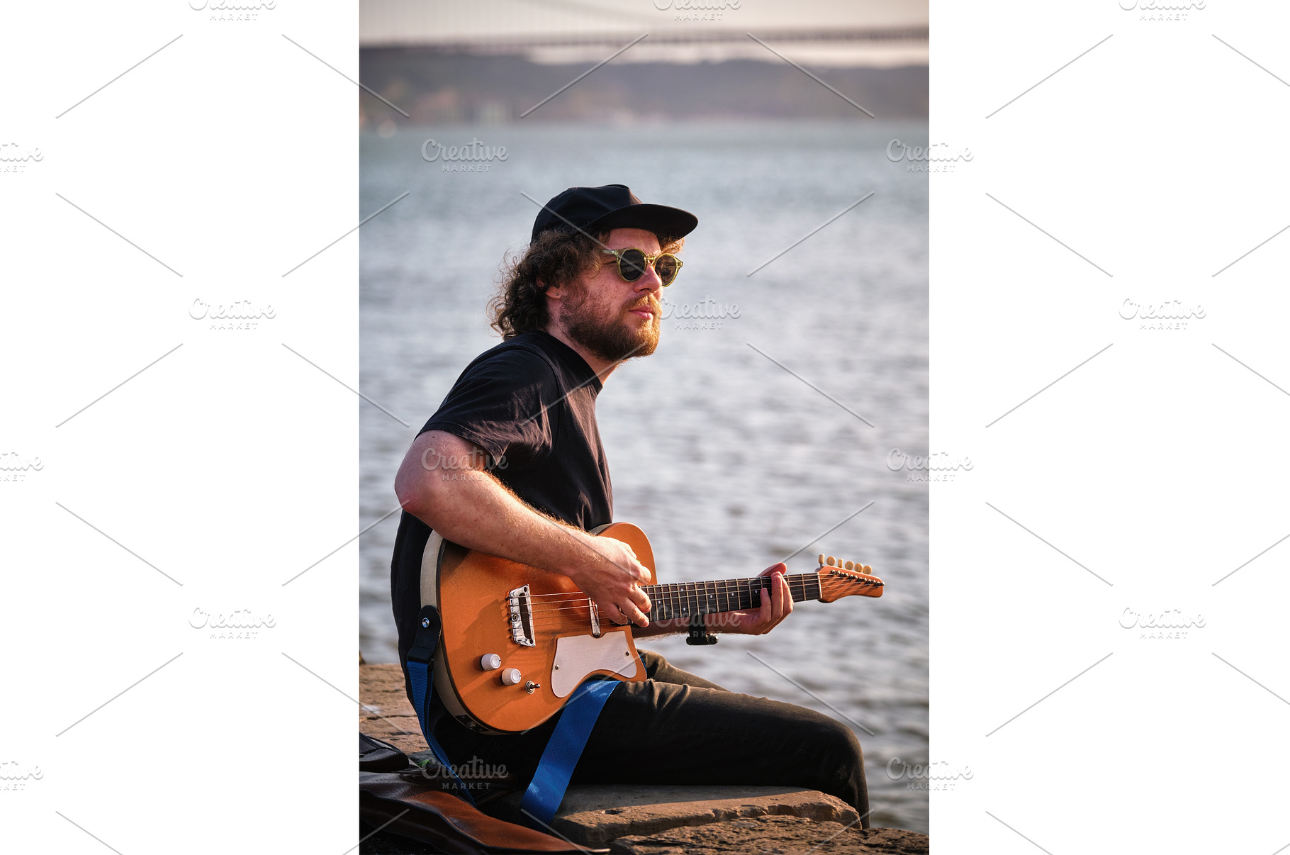 Street musician playing electric, a Person Photo by f9photos